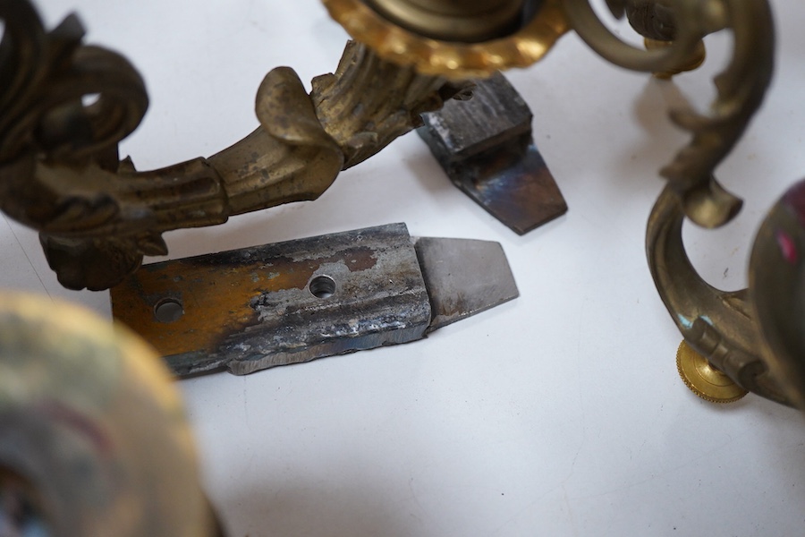 A pair of cast brass three branch wall sconces, 27cm deep
